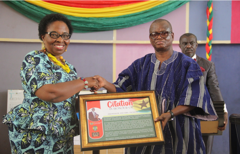Mr. Akuamoah Boateng presenting a citation to the proprietress of Jackson Educational Complex for supporting quality education in the metropolis  