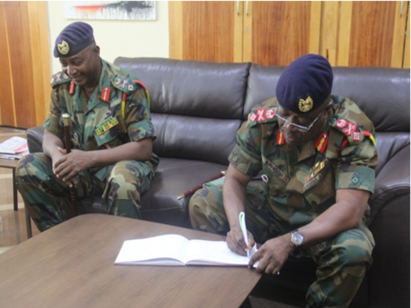 The incoming GOC, Brig. Gen. Joe Aphour signing the visitors book at the mayor’s office.