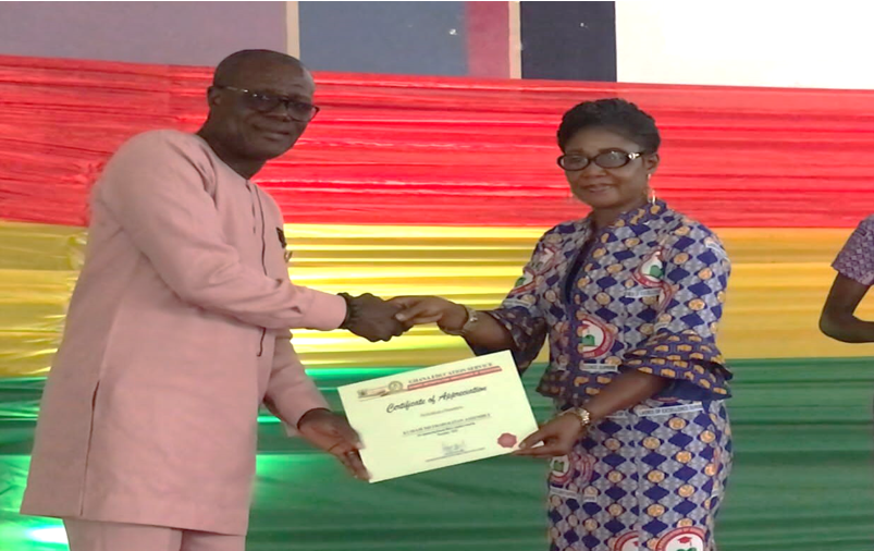 Mr. Francis Dwira Darko (MCD) receiving a certificate of appreciation on behalf of KMA from the GES