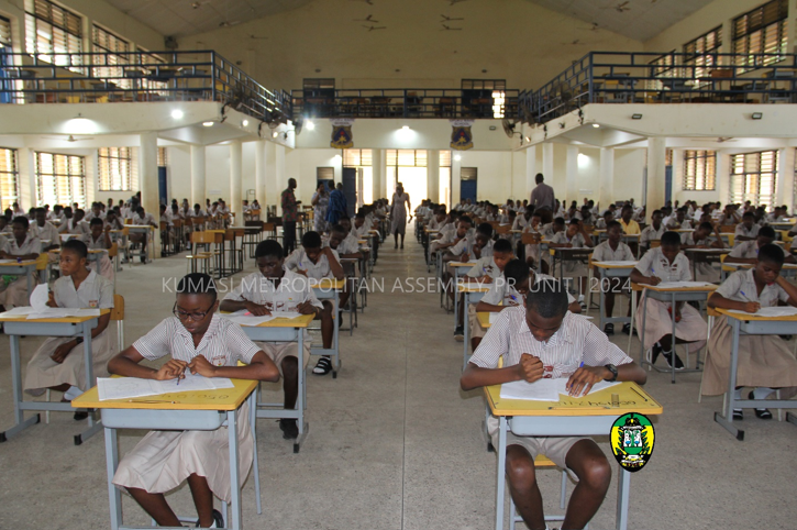 BECE candidates writing English Language exam paper at Opoku Ware SHS.