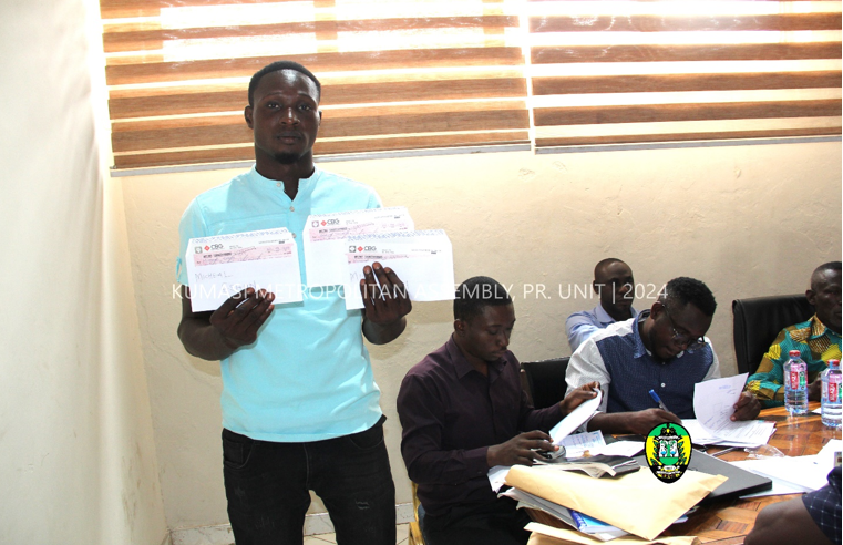 One of the beneficiaries of compensation is displaying cheques received.