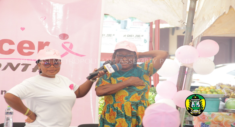 MADAM JOANA BERGESON DEMONSTRATING HOW TO SELF CHECK FOR BREAST CANCER