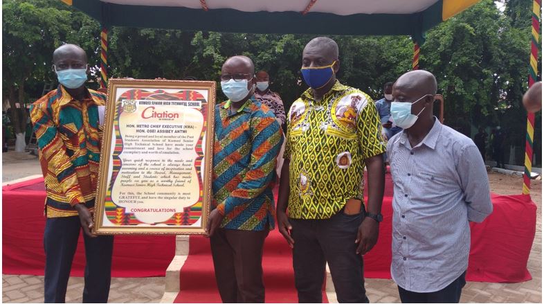 Hon. Osei Assibey Antwi (3rd from right) receiving a citation from the school